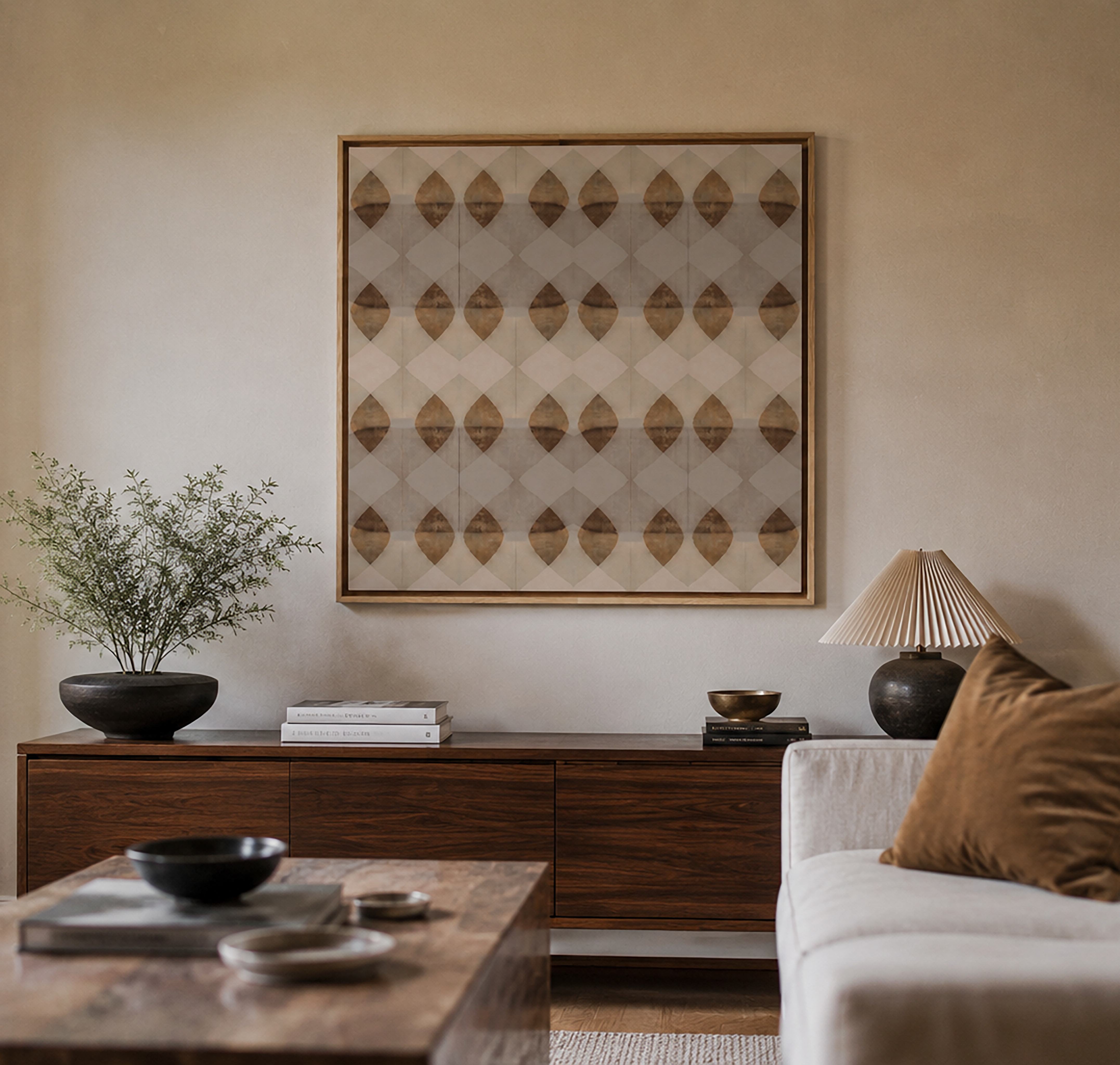 Patterns Feel Like a Prayer framed art print with its grid of warm tan leaf motifs, hung above a dark wood sideboard in a softly lit living room
