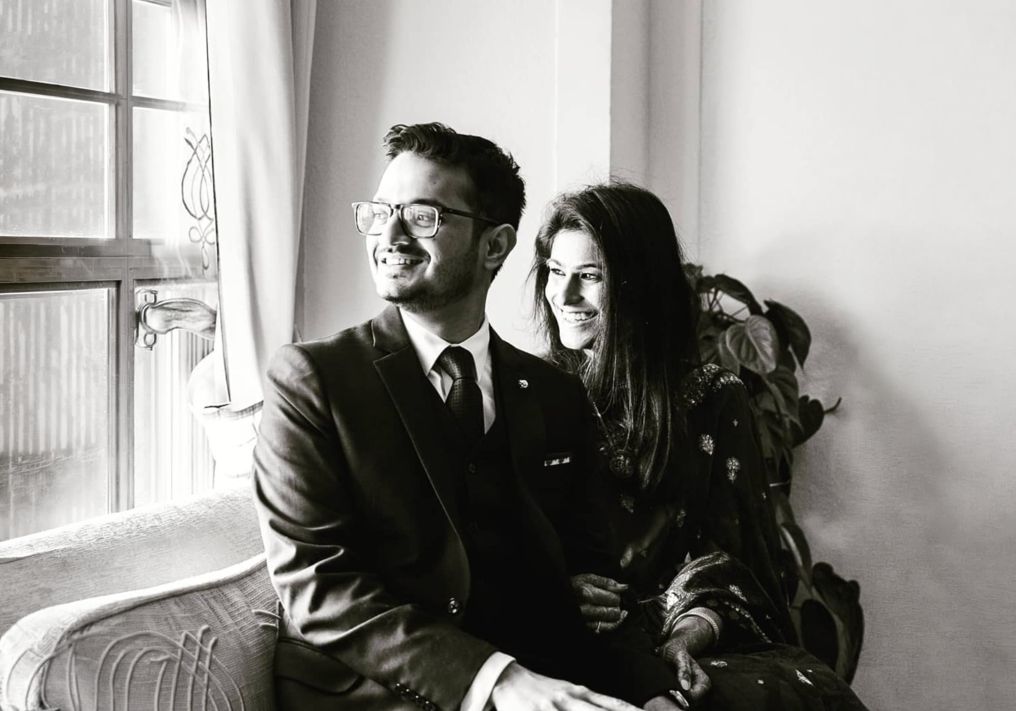 Rohan and Anisha, co-founders of India Design House, seated together by a window
